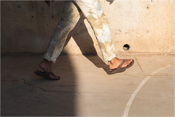 Going for a stroll in classic leather flips.