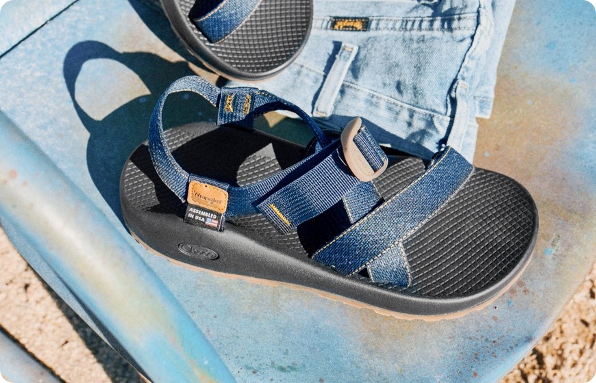 Navy Chaco Z sandal resting on a blue surface