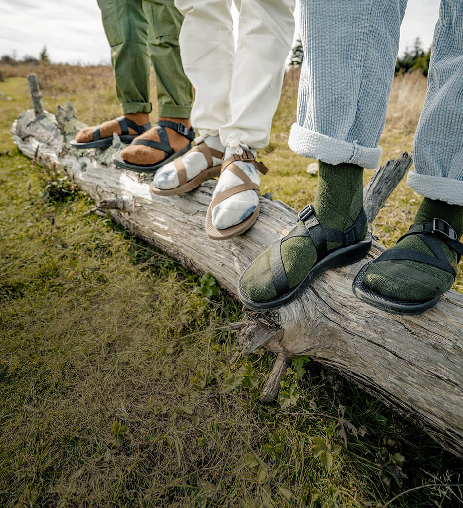 Z/Sandals being worn outside on a log