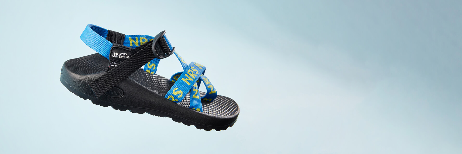 Chaco NRS sandal on a foggy blue background.