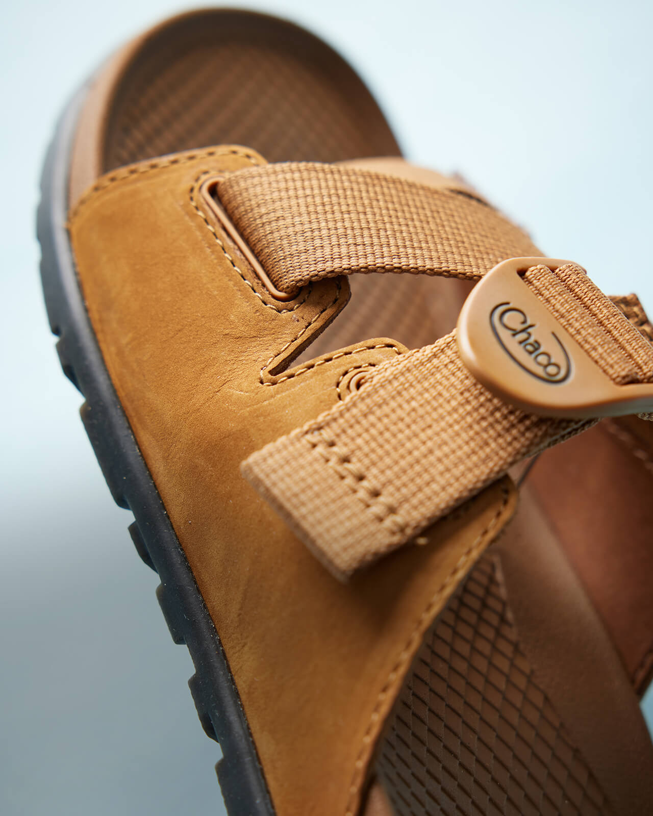 Man wearing socks and leather Chaco sandal