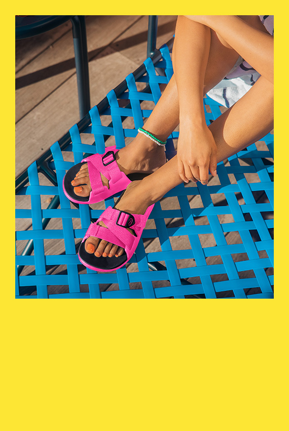 Relaxing on a deck chair with a pair of pink chillos.