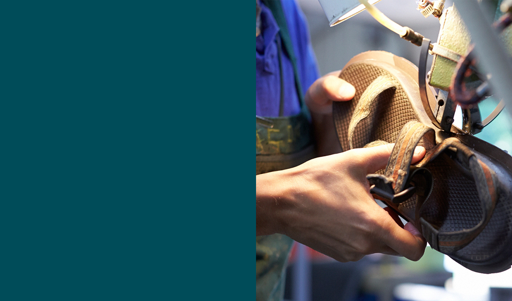 Chaco sandal being fixed.