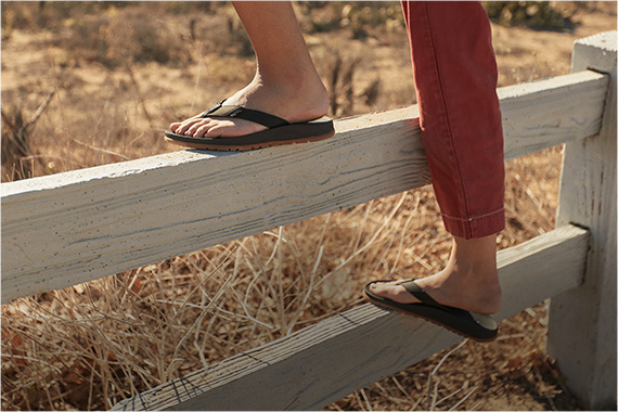 Standing on a fence, rocking some Lowdown flips.