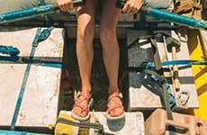 Woman crouching in Chacos