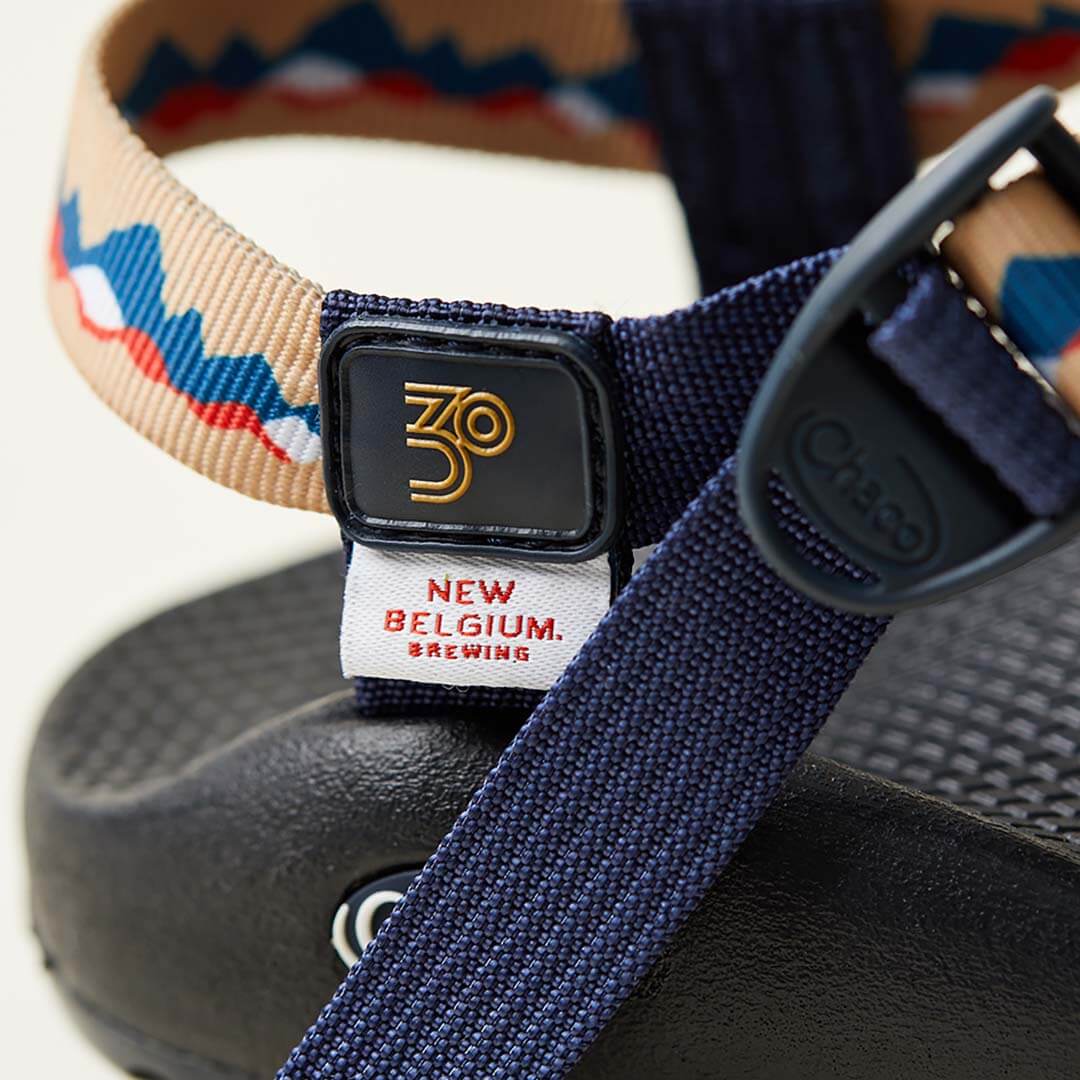Detail showing custom badge of a z/sandal, New Belgium Brewing collaborative sandal.