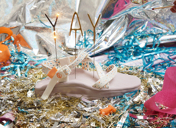Sandal with sparklers spelling YAY in it like a birthday cake.