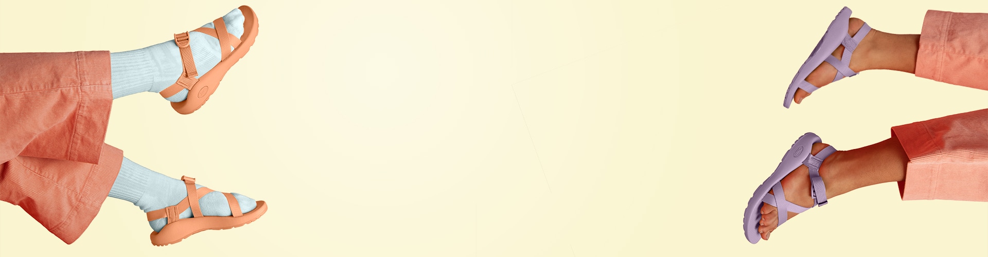 A closeup of a persons feet wearing Chaco Z-chromatic sandals, floating over a yellow background.